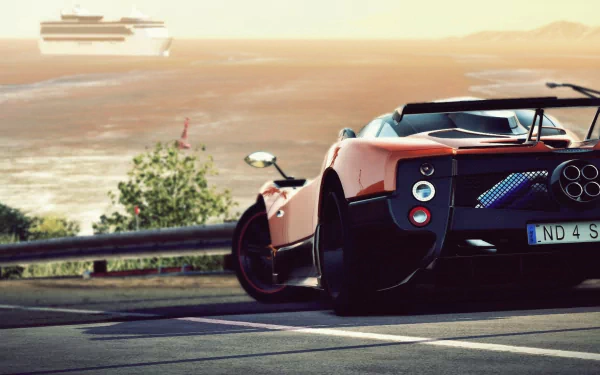A sleek Pagani Zonda parked on a winding road, with a scenic background of water and a distant ship, creating a stunning HD desktop wallpaper.
