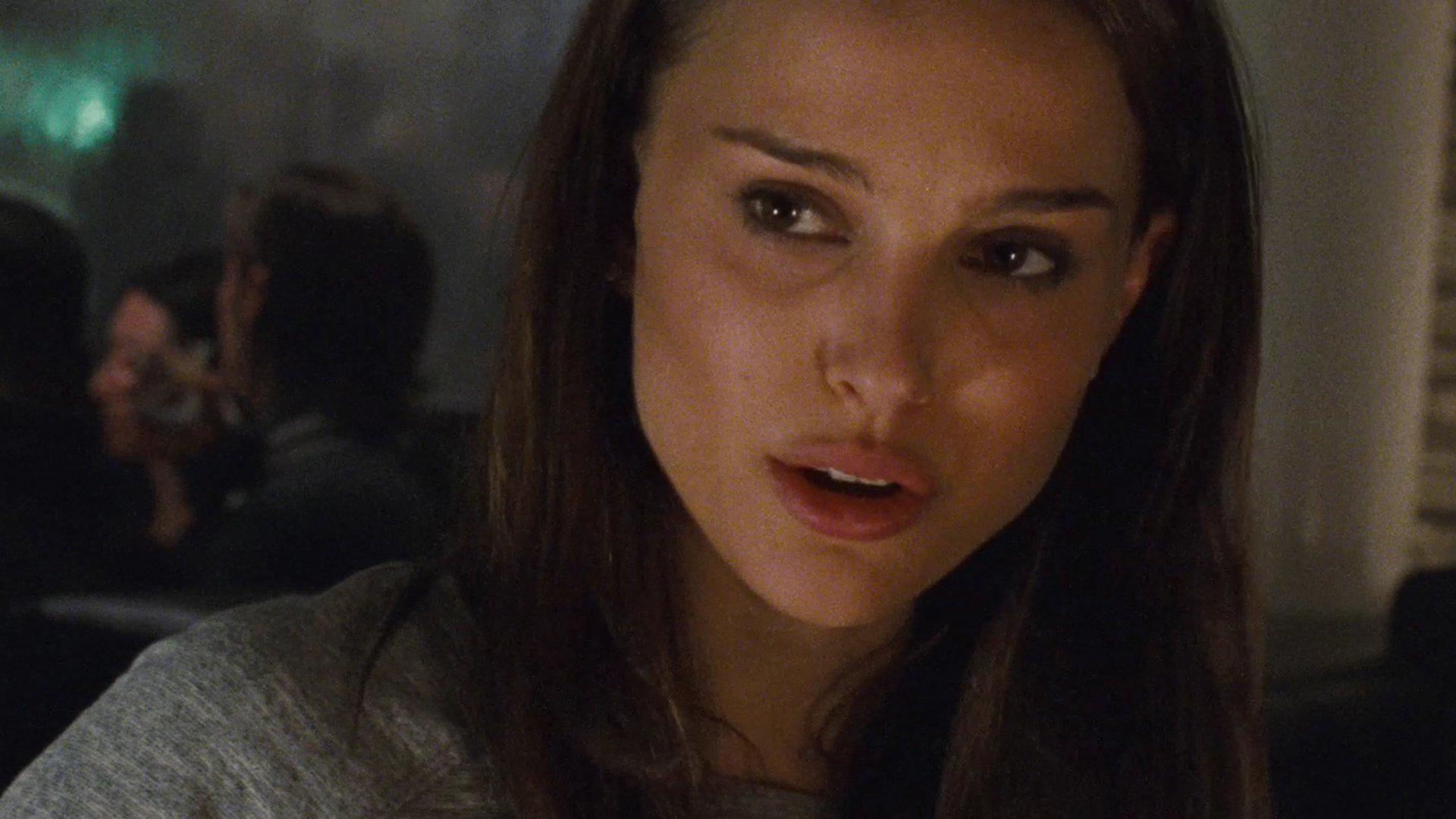 HD desktop wallpaper featuring Natalie Portman in a close-up from the movie Black Swan, capturing a dramatic and intense moment.