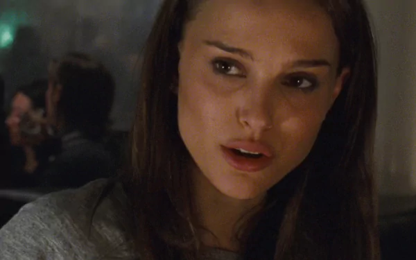 HD desktop wallpaper featuring Natalie Portman in a close-up from the movie Black Swan, capturing a dramatic and intense moment.