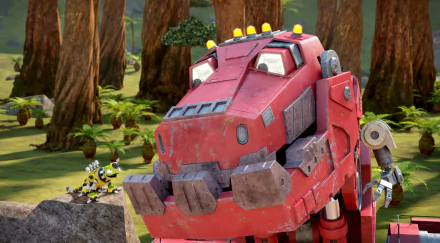 A vibrant HD wallpaper featuring Dinotrux characters in a lush forest setting, showcasing a large red robotic dinosaur with smaller machines nearby.