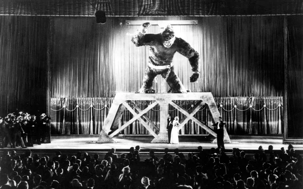 Black-and-white HD desktop wallpaper featuring King Kong from the 1933 movie, showing the giant ape on stage towering over a crowd in a dramatic scene.