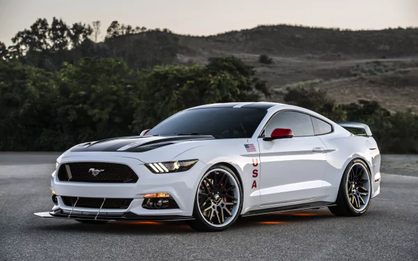Sleek white Ford Mustang parked on road with scenic hills in the background, showcased in 4K Ultra HD PC desktop wallpaper quality.