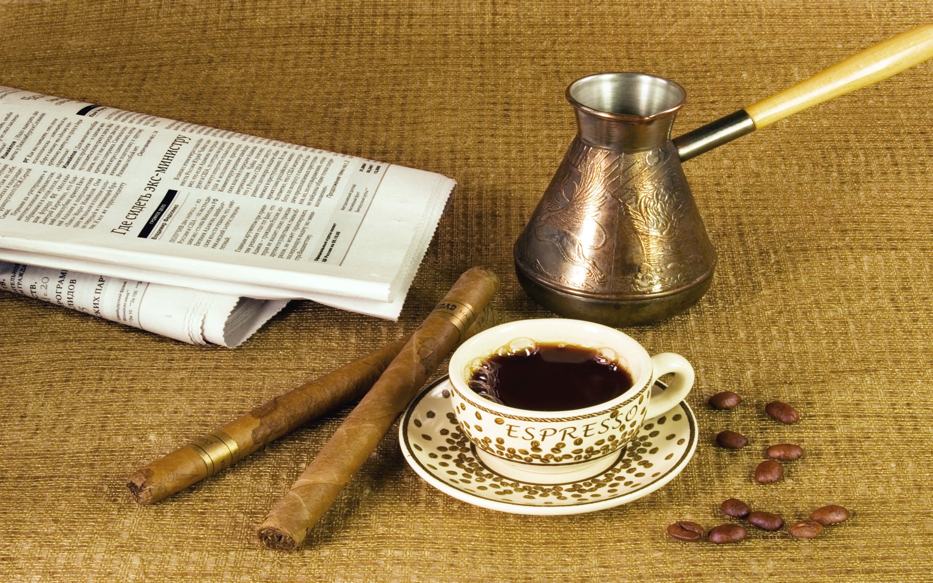 A cozy desktop wallpaper featuring a steaming cup of coffee, traditional brewing pot, cigars, coffee beans, and a newspaper, set against a textured background.
