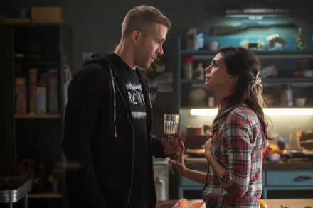 A scene from the movie Deadpool featuring Ryan Reynolds and Morena Baccarin, showcasing an intimate moment between the characters in a cozy kitchen setting.