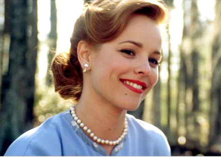 HD PC desktop wallpaper featuring Rachel McAdams in a scene from the movie The Notebook, showcasing a close-up of her smiling with a natural outdoor background.