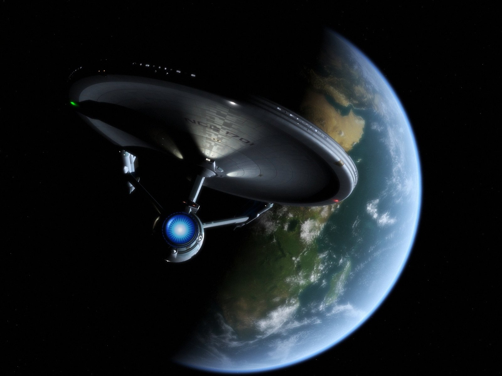 A striking HD desktop wallpaper featuring the iconic starship Enterprise soaring above Earth, embodying the adventurous spirit of sci-fi and Star Trek.