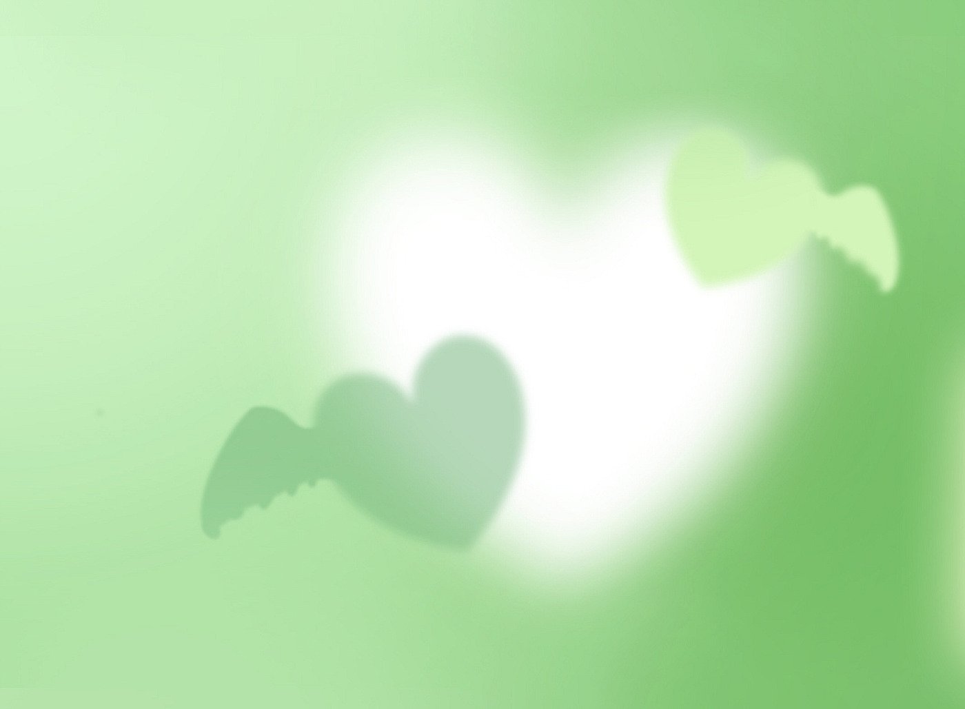 Artistic HD PC desktop wallpaper featuring soft, glowing green hearts against a blurred green background, evoking a serene and loving atmosphere.