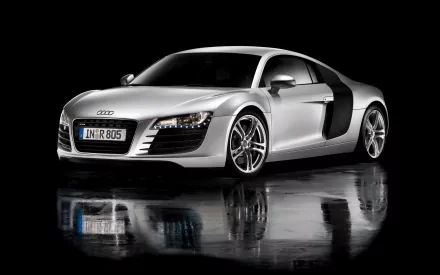 HD desktop wallpaper featuring a sleek silver Audi R8 against a black background, showcasing the vehicle's dynamic design and polished look.