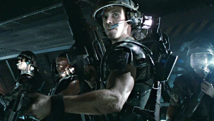HD PC desktop wallpaper featuring intense soldiers from the movie Alien, capturing a tense sci-fi atmosphere with dark, industrial lighting and futuristic gear.