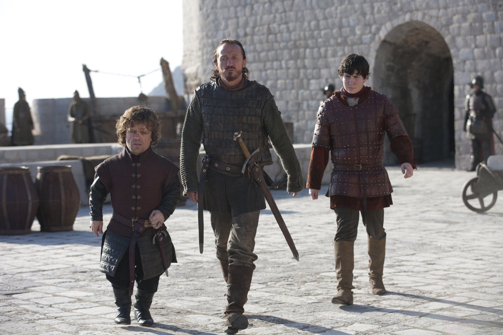 Daniel Portman as Podrick Payne, Jerome Flynn as Bronn, and Peter Dinklage as Tyrion Lannister walk together in a Game of Thrones 4K Ultra HD wallpaper.