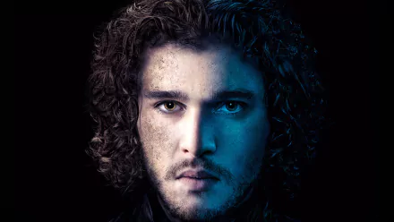 Close-up portrait of Jon Snow from Game of Thrones, portrayed by Kit Harington. The image features striking contrasts with a dark background, creating a dramatic effect.