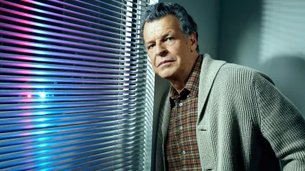 HD PC desktop wallpaper background showing a contemplative older man in a cardigan by venetian blinds, promotional image from the TV show Fringe.