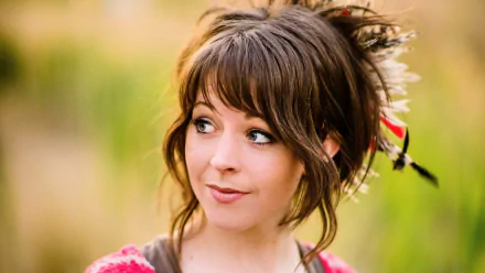 HD PC desktop wallpaper featuring musician Lindsey Stirling with a soft, natural background.