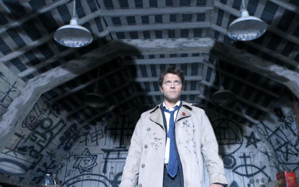 HD wallpaper depicting a scene from the TV show Supernatural with a character standing in a room covered in symbols and dim lighting.