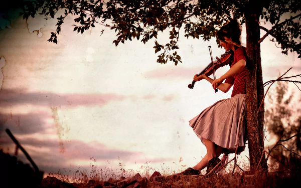 4K Ultra HD PC desktop wallpaper: female violinist seated in a tree at sunset, playing music with a flowing skirt against a soft pastel sky.