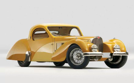 HD PC desktop wallpaper featuring a detailed vintage yellow Bugatti Type 57 vehicle against a plain light background.