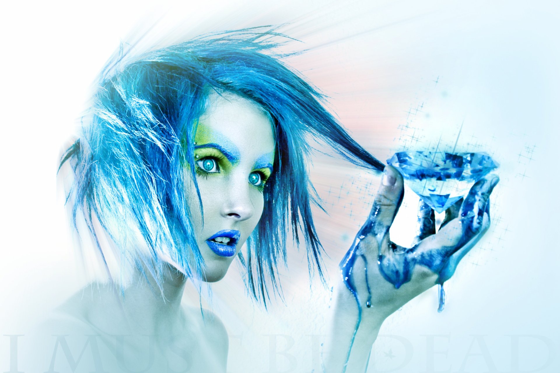 Artistic HD PC wallpaper featuring a woman with vibrant blue hair and striking green eyes, holding a crystal-like object with blue paint on her hand.