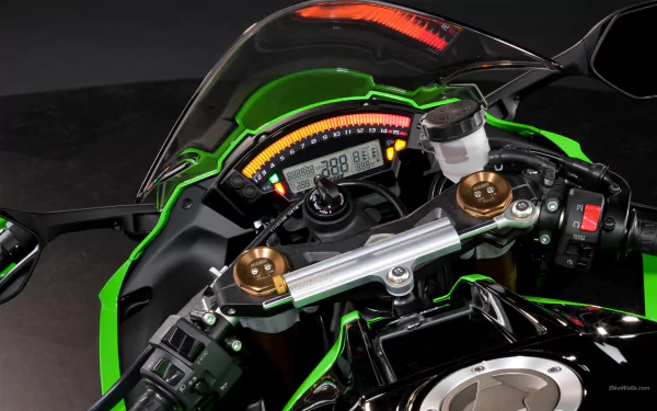 Close-up of a Kawasaki Ninja motorcycle's dashboard, showcasing its sleek design and high-tech instrumentation. A striking HD PC desktop wallpaper and background.