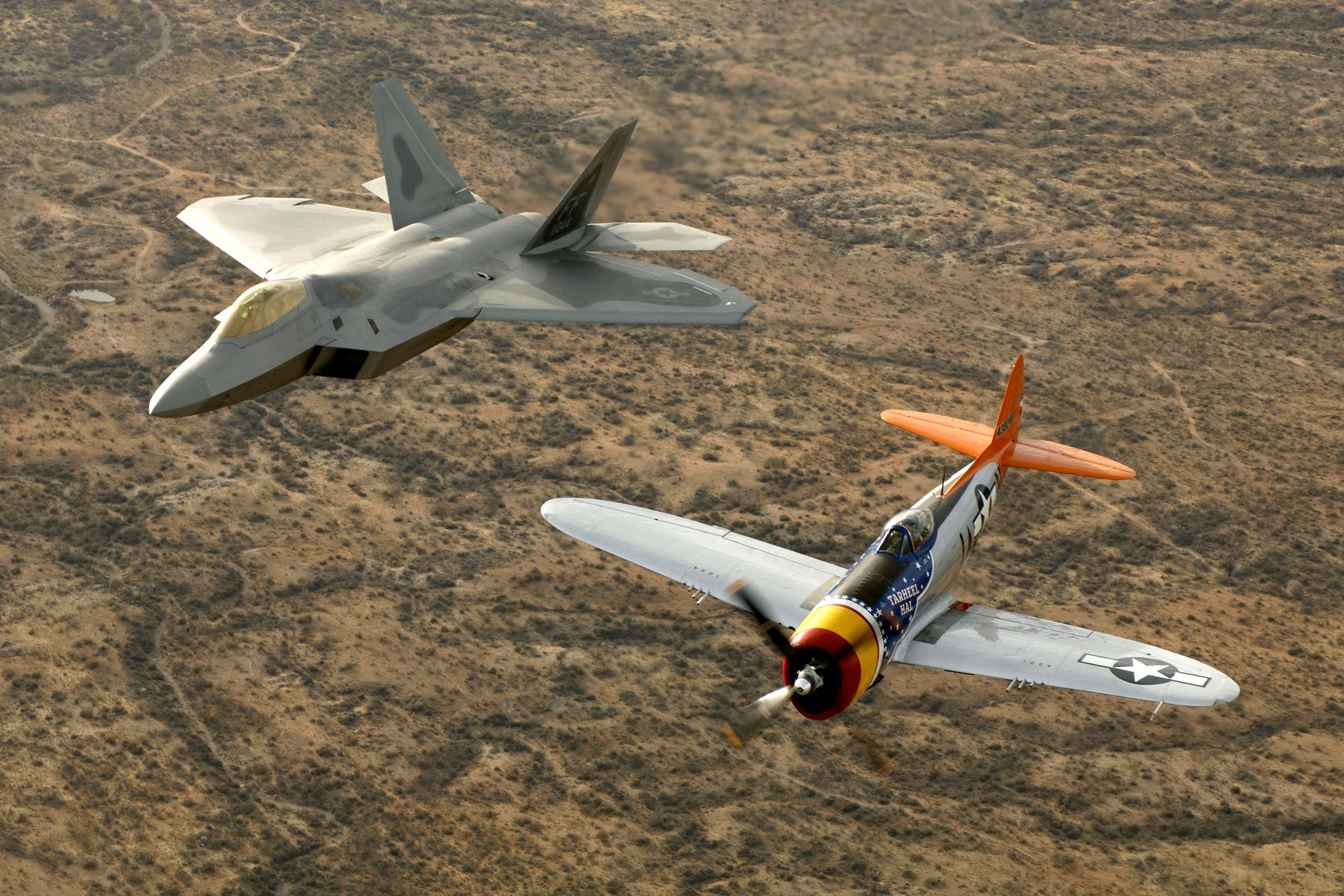 F-22 Raptor flying alongside WWII aircraft.