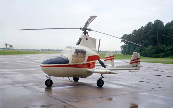 McCulloch J-2 Aero Super Gyroplane helicopter parked on wet tarmac under an overcast sky — NASA vehicle, HD PC desktop wallpaper/background.