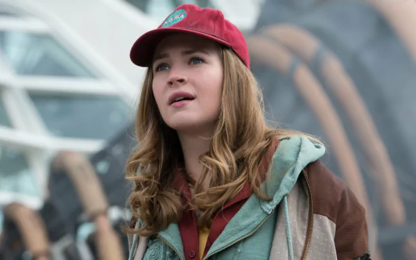 Brittany Robertson from the movie Tomorrowland is featured in a 4K Ultra HD PC desktop wallpaper, wearing a red cap and layered casual jacket.