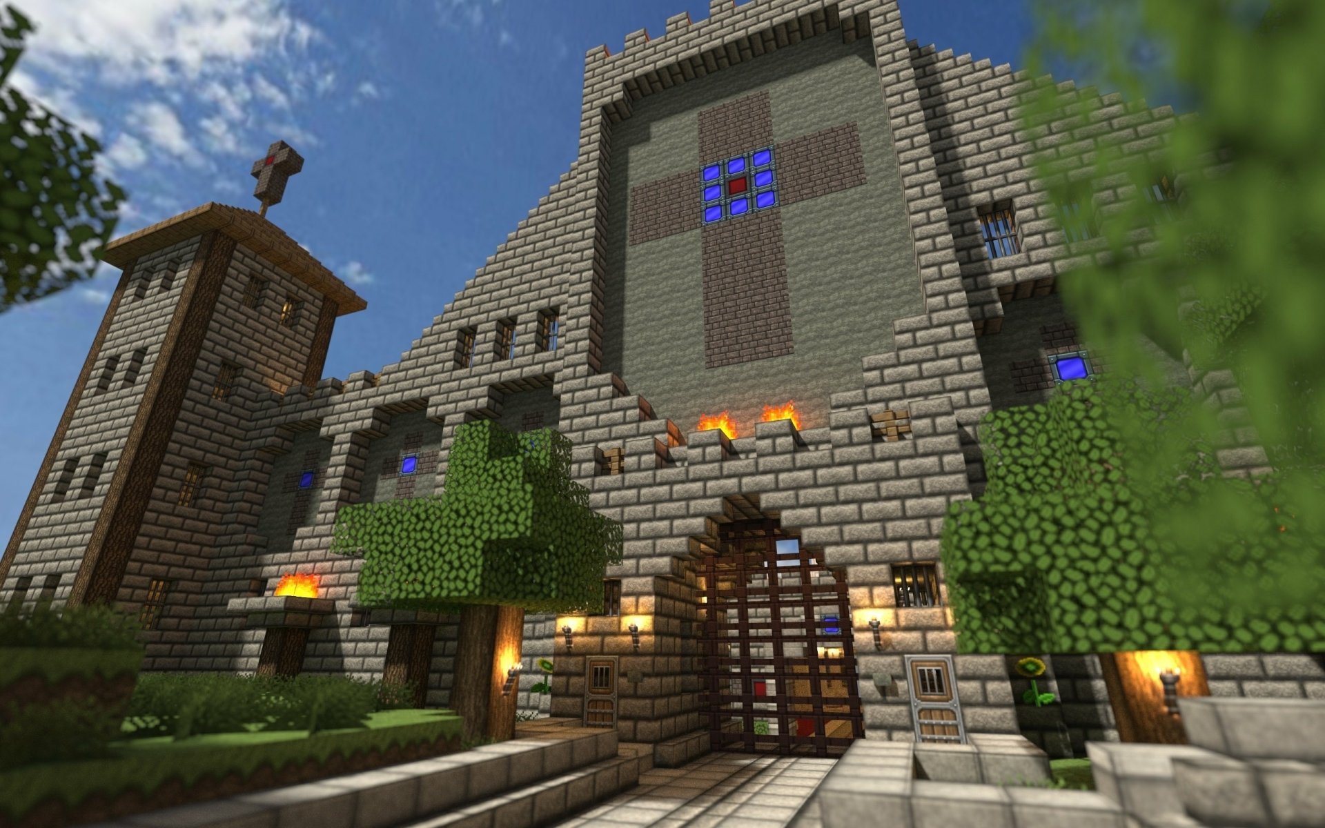 A vibrant HD Minecraft wallpaper featuring a grand stone castle surrounded by lush greenery and a clear blue sky, showcasing the game's unique blocky aesthetic.