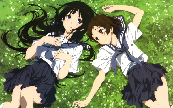Two anime characters, Mayaka Ibara and Eru Chitanda, in school uniforms, lie on a grassy field, surrounded by greenery, from the series Hyouka. High-definition desktop wallpaper.