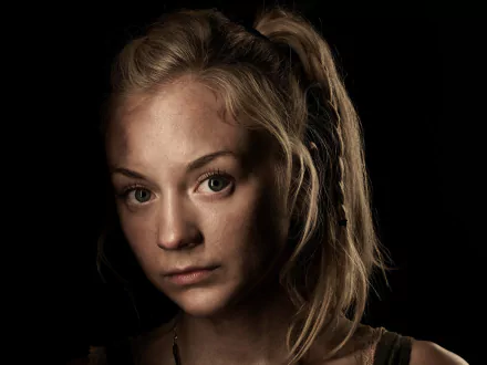 A close-up of actress Emily Kinney as Beth Greene from the TV show The Walking Dead, featuring a dramatic expression against a dark background. HD wallpaper quality.
