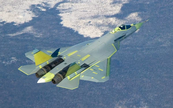 A sleek Sukhoi Su-57 jet soars through the sky, showcasing its advanced design and military technology against a backdrop of treetops and snow. An impressive HD wallpaper.