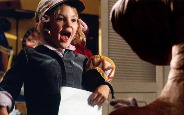 A scene from the movie E.T. the Extra-Terrestrial as HD desktop wallpaper, featuring a young girl interacting with E.T. in a delighted moment.