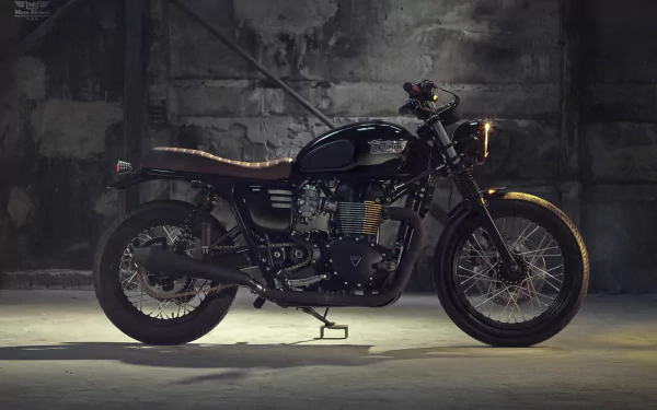 HD desktop wallpaper featuring a sleek black Triumph Bonneville motorcycle against a textured concrete wall background.