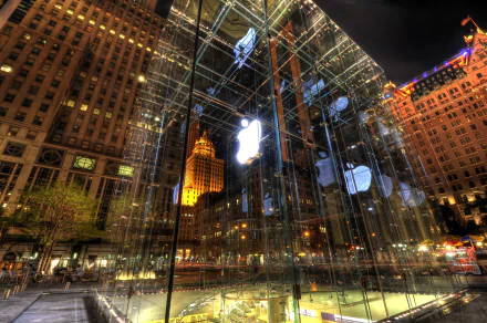 4K Ultra HD image of the iconic Apple Store glass cube in New York, showcasing HDR lighting and modern architecture in a vibrant urban night setting.