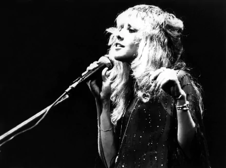 Black and white 4K Ultra HD desktop wallpaper featuring Stevie Nicks singing into a microphone, capturing a classic music moment.