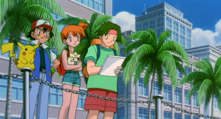 A colorful HD desktop wallpaper featuring Ash Ketchum, Misty, and Tracey from Pokémon: The Movie 2000, with Pikachu beside them and palm trees in the background.