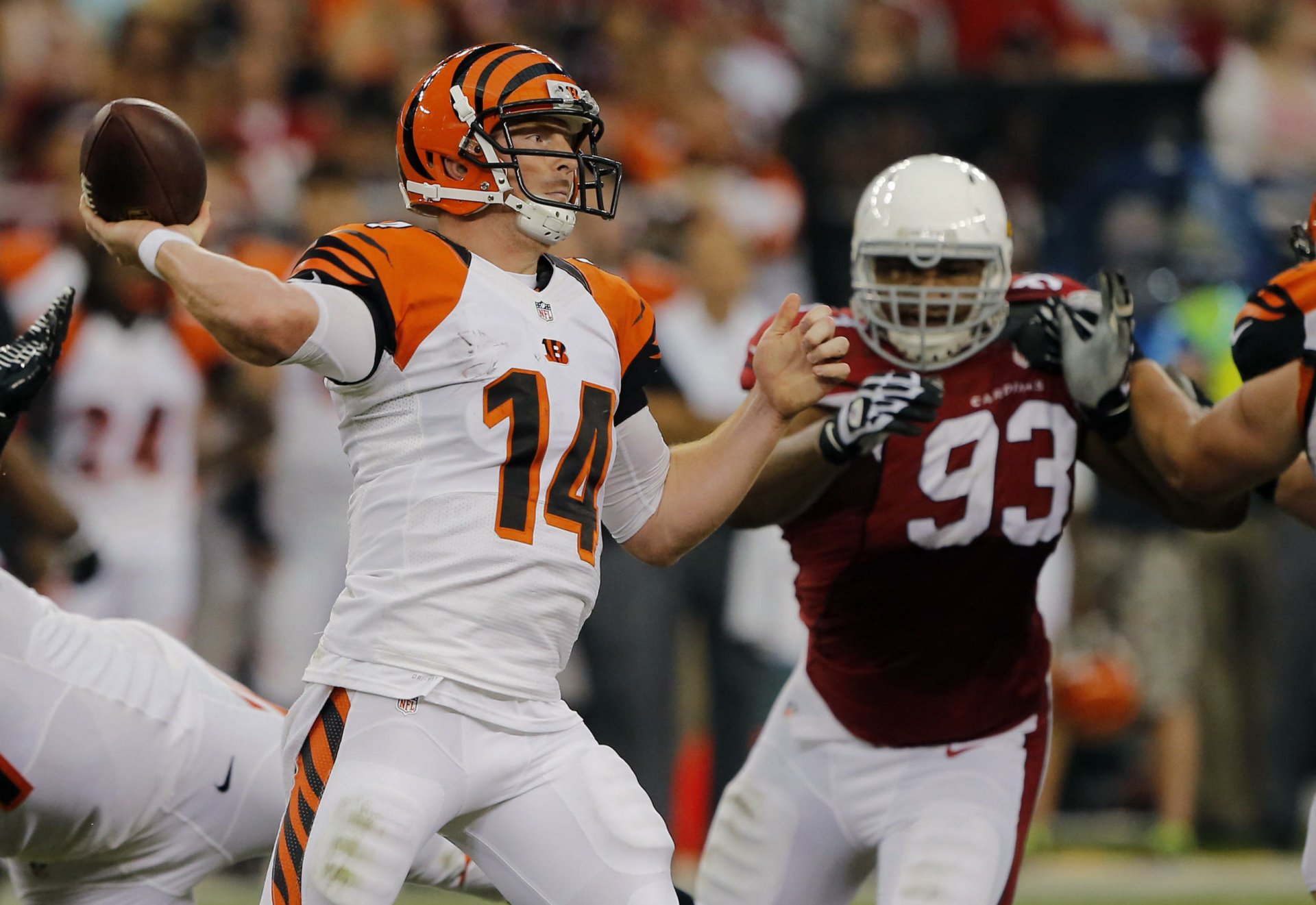 Action shot of a Cincinnati Bengals quarterback throwing under pressure from a defender — 2K Quad HD PC desktop wallpaper and sports background.