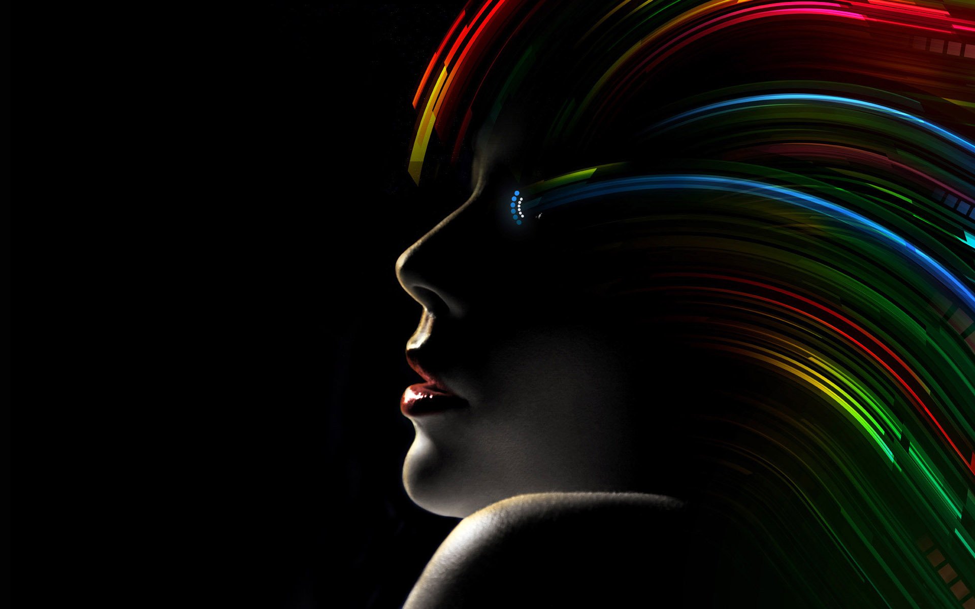 An artistic depiction of a human silhouette with vibrant, colorful hair flowing against a dark background, creating a striking and visually engaging HD desktop wallpaper.