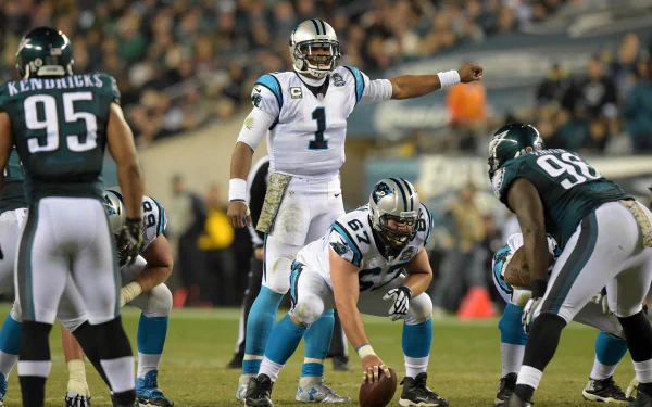 HD PC desktop wallpaper featuring the Carolina Panthers football team in action during an intense game against the Philadelphia Eagles.