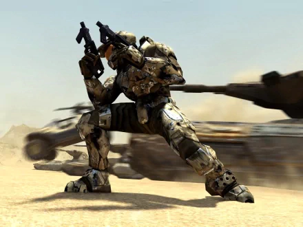 A Spartan from the video game Halo poses dynamically with weapons drawn, set against a desert landscape with military vehicles in the background. HD desktop wallpaper.