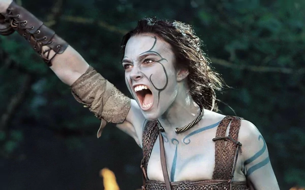 Keira Knightley in character, fierce and battle-ready, from the movie King Arthur, featured in a high-definition PC desktop wallpaper.