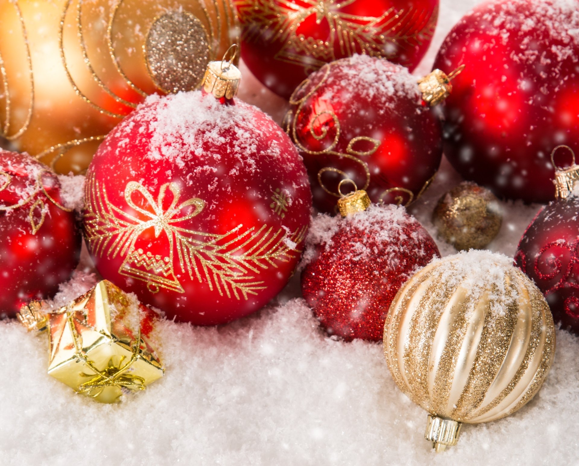HD PC desktop wallpaper featuring festive Christmas ornaments dusted with snow, highlighting holiday cheer and seasonal decoration.
