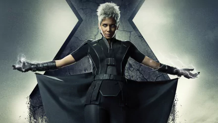 Halle Berry as Storm from Marvel's X-Men in a striking pose, showcasing her powerful abilities. This HD wallpaper features a dramatic backdrop inspired by X-Men: Days of Future Past.
