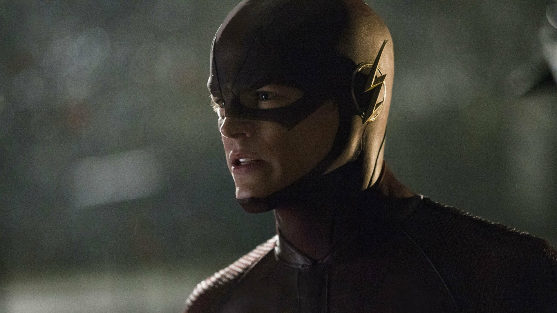 Grant Gustin as Barry Allen in his Flash suit, captured in a dramatic moment. This HD wallpaper showcases The Flash from the TV show (2014), emphasizing action and intensity.