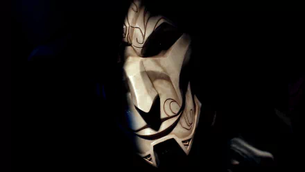 HD desktop wallpaper of Jhin from League of Legends, featuring his masked face partially illuminated in a dark, dramatic setting.