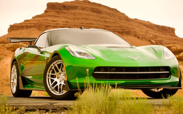 A striking green Chevrolet Corvette from the movie Transformers: Age of Extinction, parked in a desert landscape, showcasing its sleek design and cinematic appeal.