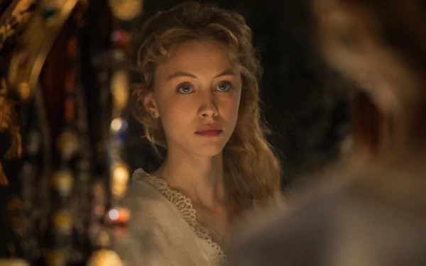 A high-definition desktop wallpaper featuring a scene from the movie Dracula Untold, showing a woman with long, wavy hair gazing intently, illuminated by warm, soft light.