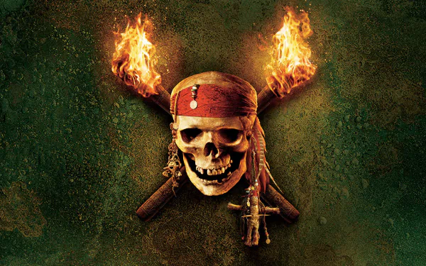 A striking HD wallpaper featuring a skull adorned with a red bandana, flanked by flaming torches, inspired by *Pirates of the Caribbean: Dead Man's Chest*.