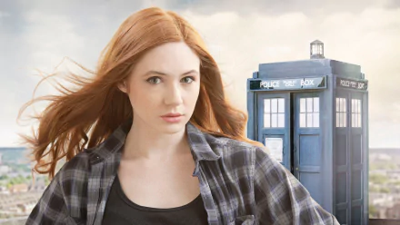 HD desktop wallpaper featuring Amy Pond (Karen Gillan) from the TV show Doctor Who (2005) standing in front of the iconic blue TARDIS police box.