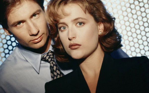 HD desktop wallpaper featuring the main characters of the TV show The X-Files in a close-up portrait with a textured background.