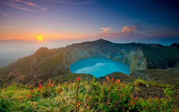 Sunrise over a vibrant flower-filled landscape overlooking a serene lake in the Azores, Portugal, captured in vivid HD for a stunning desktop wallpaper.