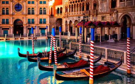 Colorful gondolas float on the turquoise water of Venice's Grand Canal, framed by historic Italian architecture under warm sunlight in this HD desktop wallpaper.